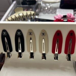 CHANEL Black, Cream, and Red Hair Clips